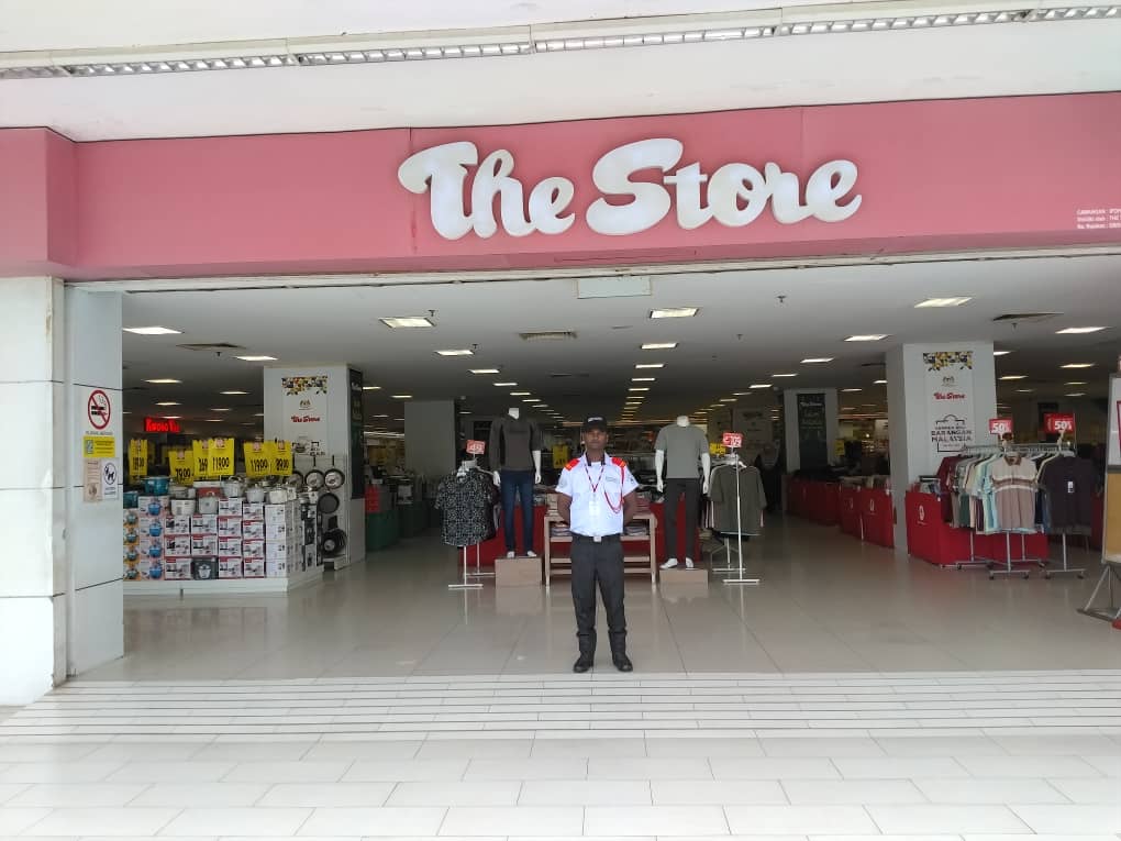 KSD Security guard providing retail security at The Store department store entrance