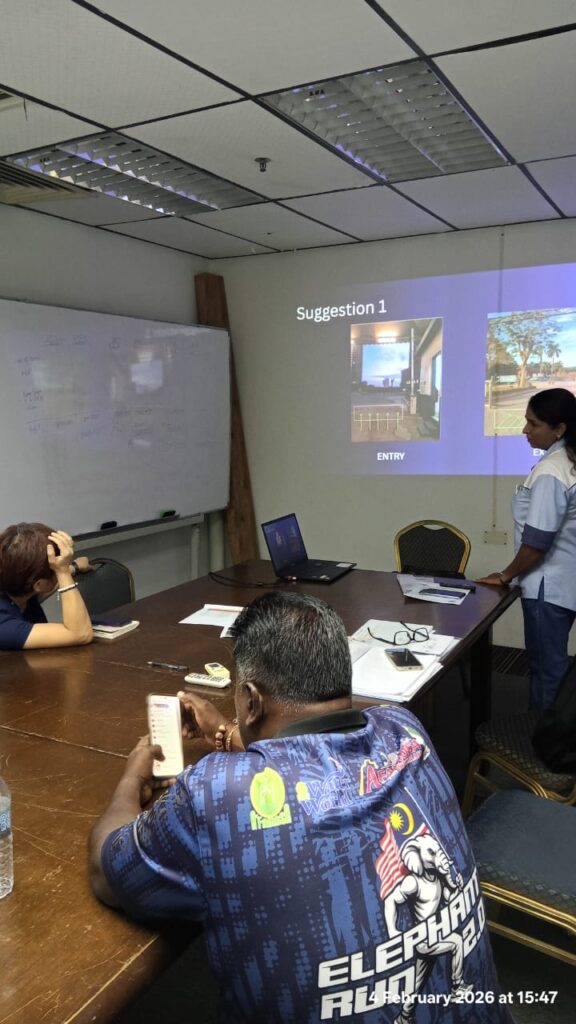 KSD Security team reviewing CCTV camera placement suggestions with a client during a site planning meeting in a boardroom.